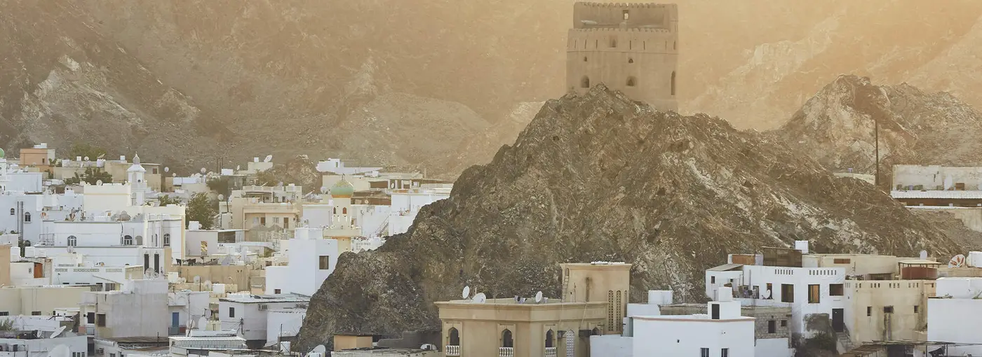 Mutrah in Muscat, its watchtower above the whitewashed houses